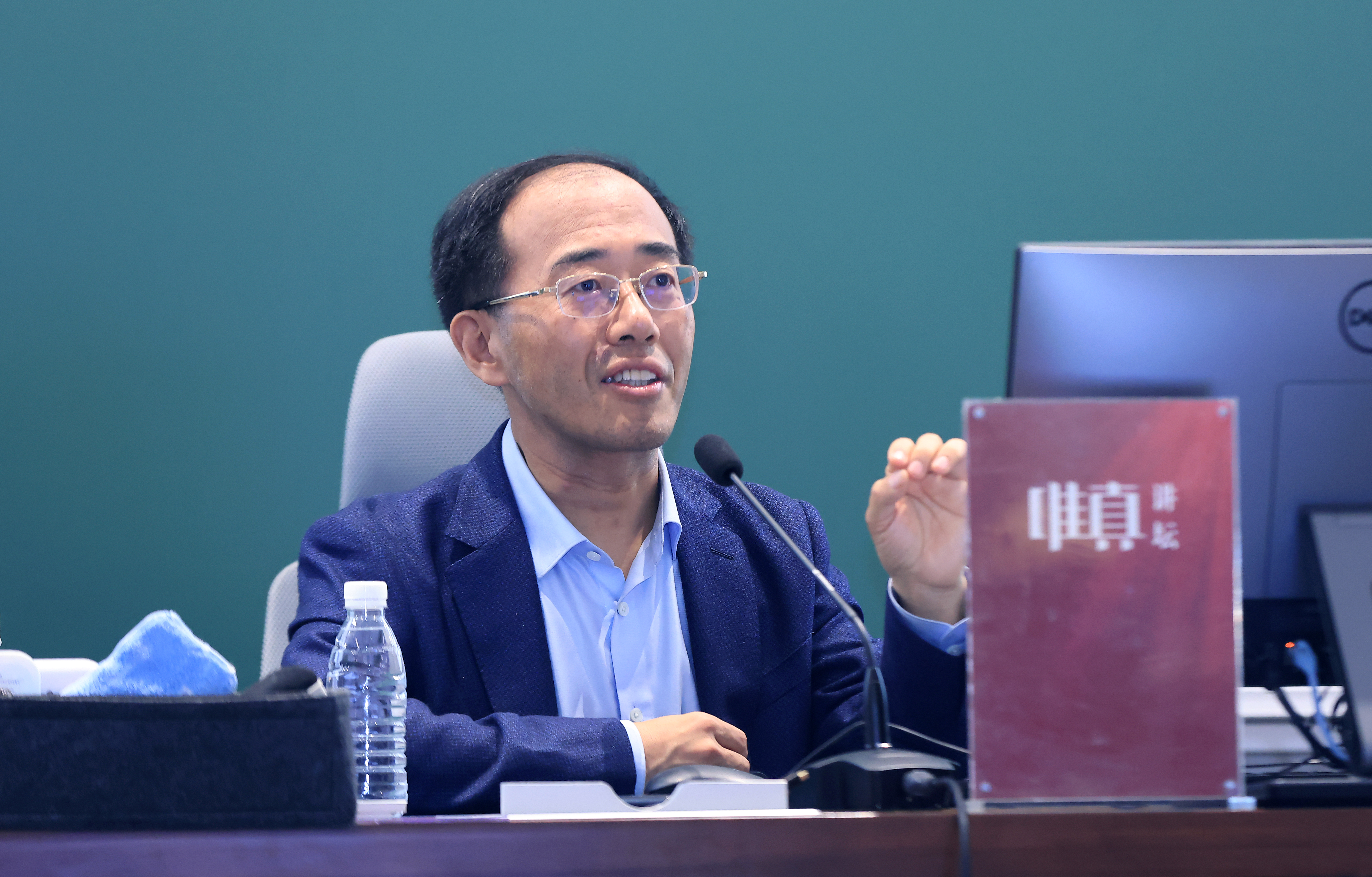 20260413-唯真讲坛-孙海波-梁正作报告.JPG